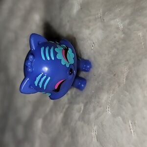 Hatchimals CollEGGtibles figurine, specifically a purple Tigrette